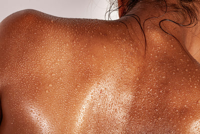 Person upper back with some drops of water