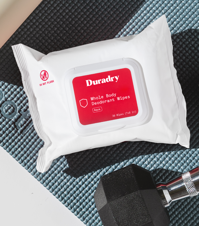 Pack of Duradry whole body deodorant wipes on a textured surface.