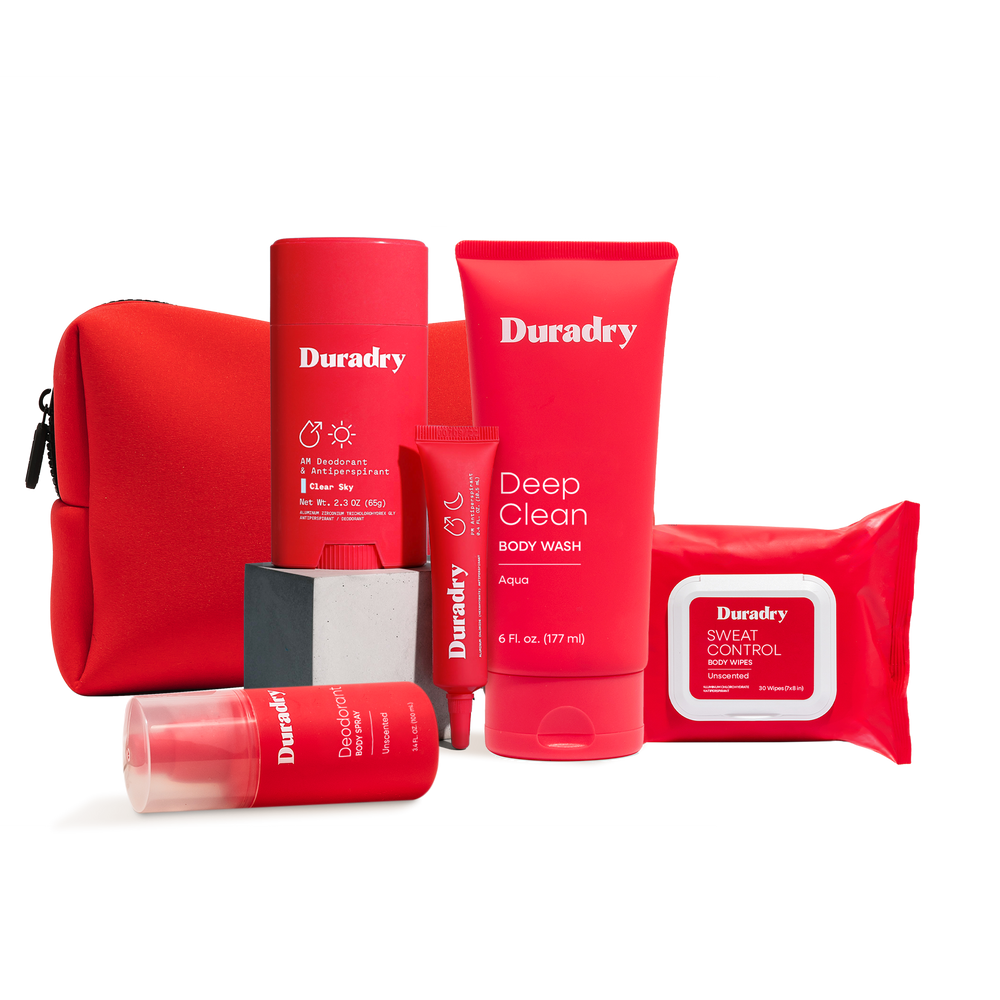 Duradry Signature Starter Kit with red travel bag — five-piece full-body sweat care set including Clinical Sweat Control Stick, Sweat Minimizing Gel, Deep Clean Body Wash, Deodorant Body Spray and Sweat Control Body Wipes